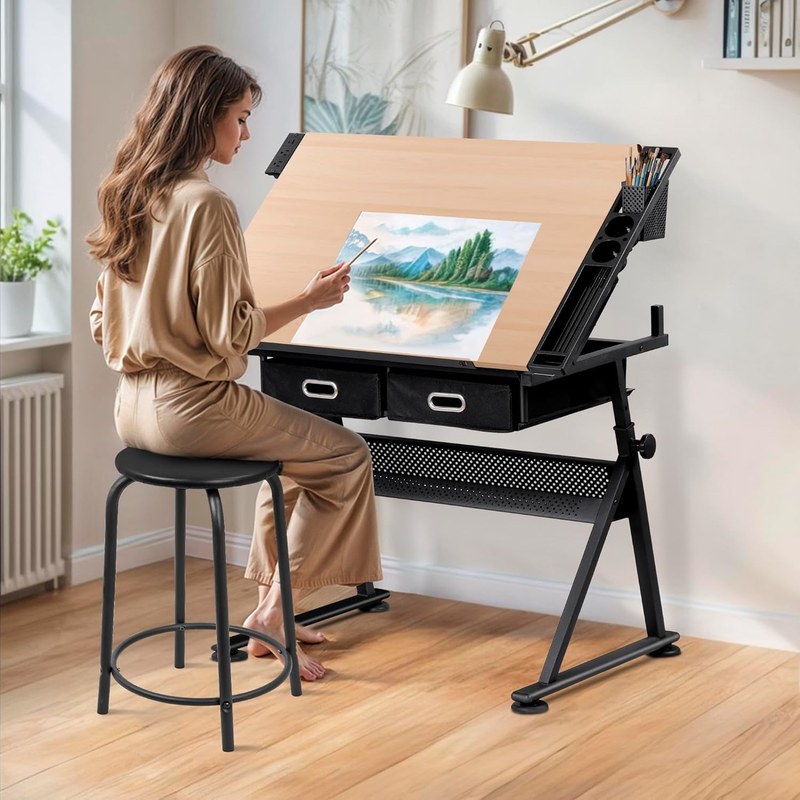 Drawing desk with adjustable angle, storage drawer, and drafting tools on the surface