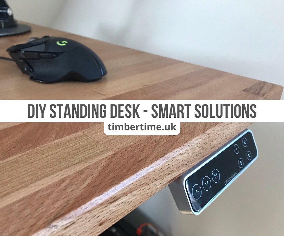 Plywood desktop panels, clamps, drill, measuring tape, and safety glasses arranged on a workbench