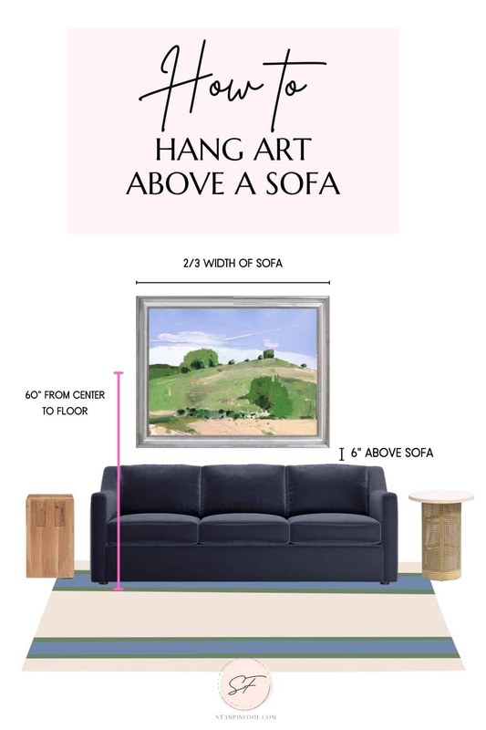 Measuring tape held above a sofa to mark picture ledge height on a wall