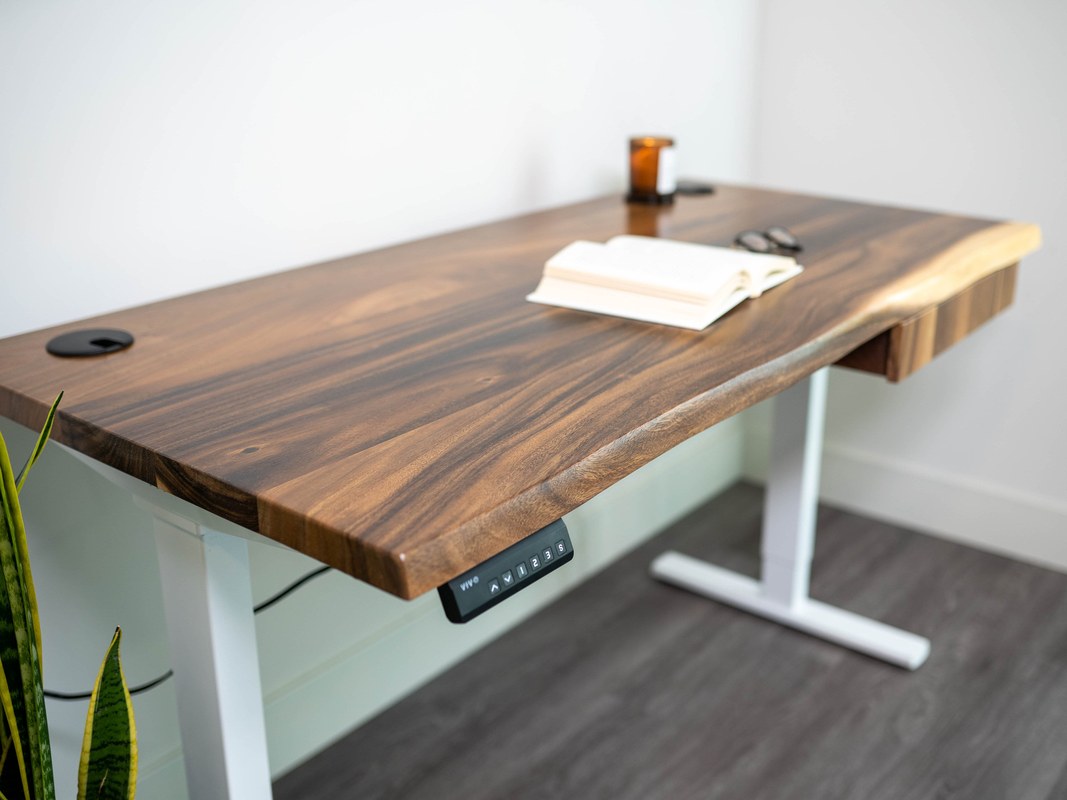 Standing desk desktop samples showing wood grain, laminate, and edge finish quality comparisons