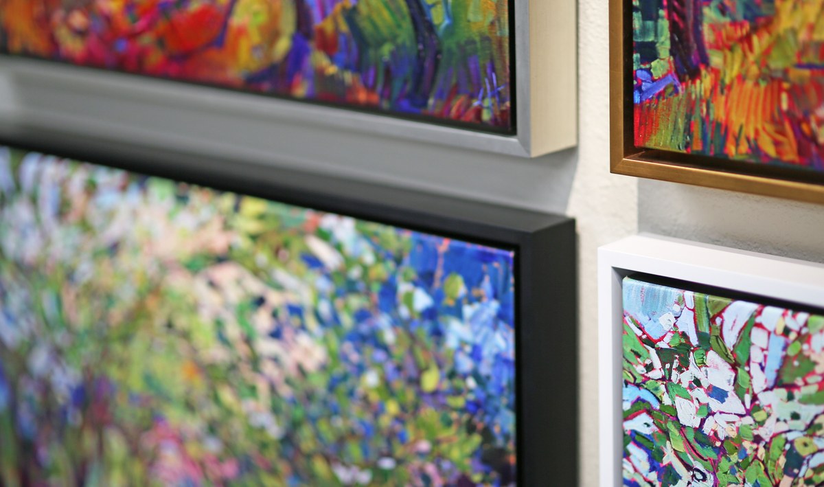 Comparison of a floater frame and a regular frame on canvas art, showing the gap in the floater frame.