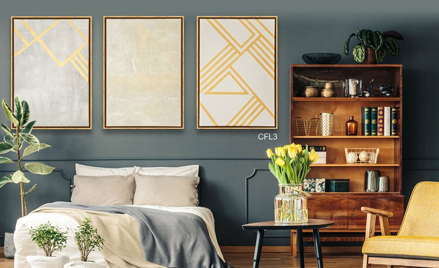 Floater frame canvas art in a modern living room beside a regular framed canvas in a traditional room