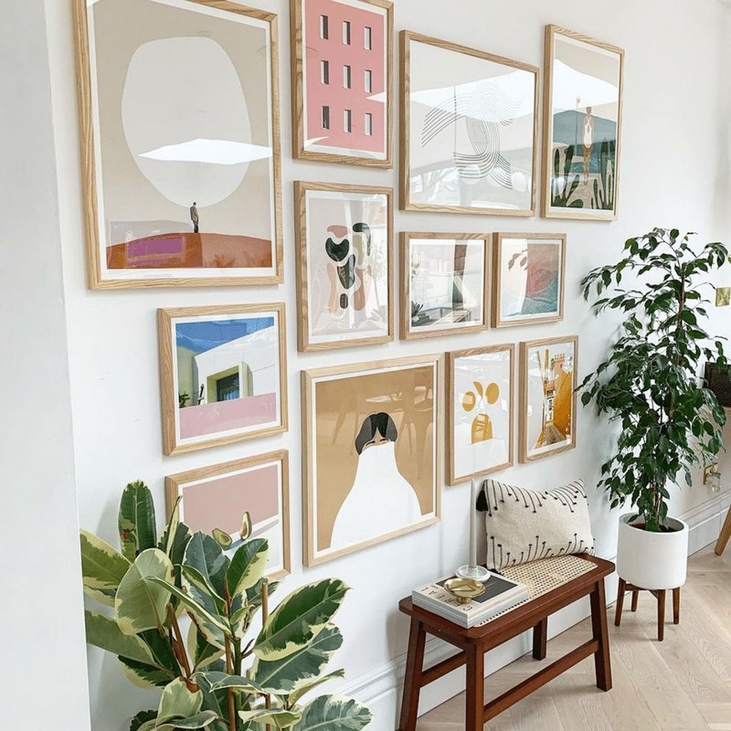 Mat board samples placed over a painting to compare its dominant color tones for framing