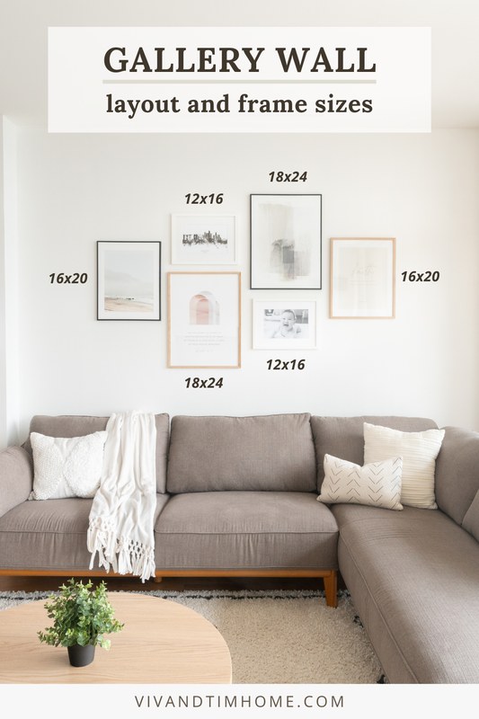 A gallery wall mixing white and wood picture frames in varied sizes with consistent spacing on a light wall
