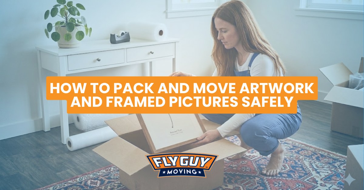 Person inspecting a framed picture's glass and frame condition before moving it safely.