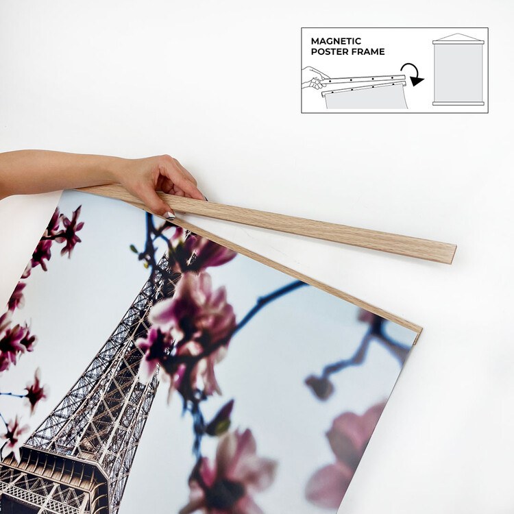 Magnetic poster hanger on wall displaying poster, top and bottom magnetic bars visible